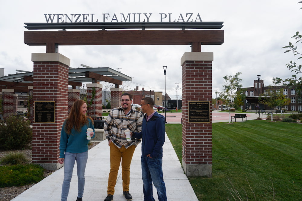Trio under Wenzel Family Plaza arch