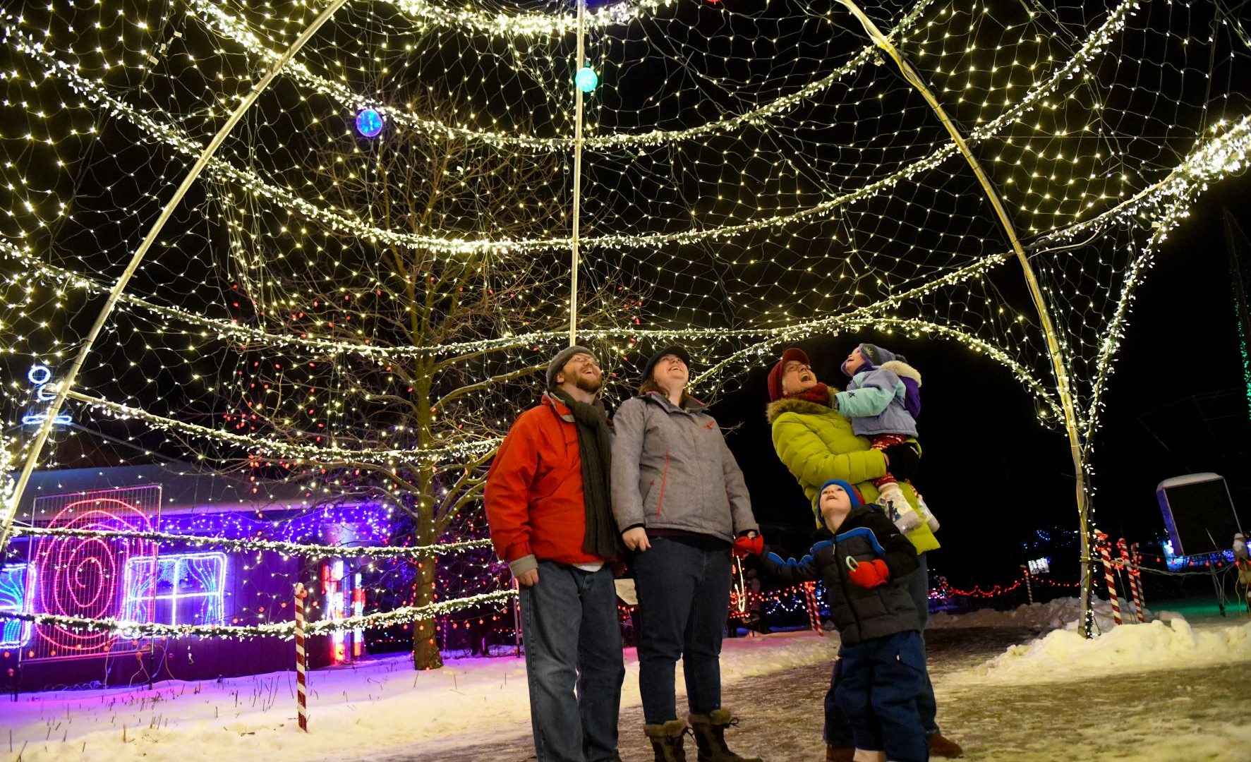 Family under igloo at Rotary Winter Wonderland