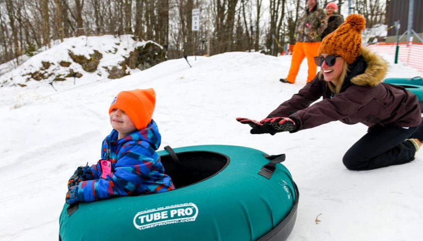 Mother and child tubing at Powers Bluff County Park in central Wisconsin