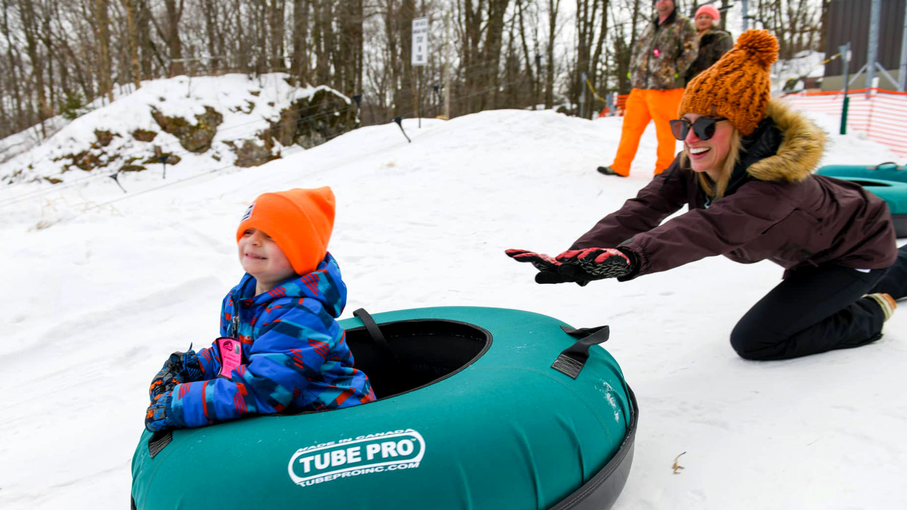 Your guide to winter fun in Marshfield | Mother and child tubing at Powers Bluff County Park in central Wisconsin