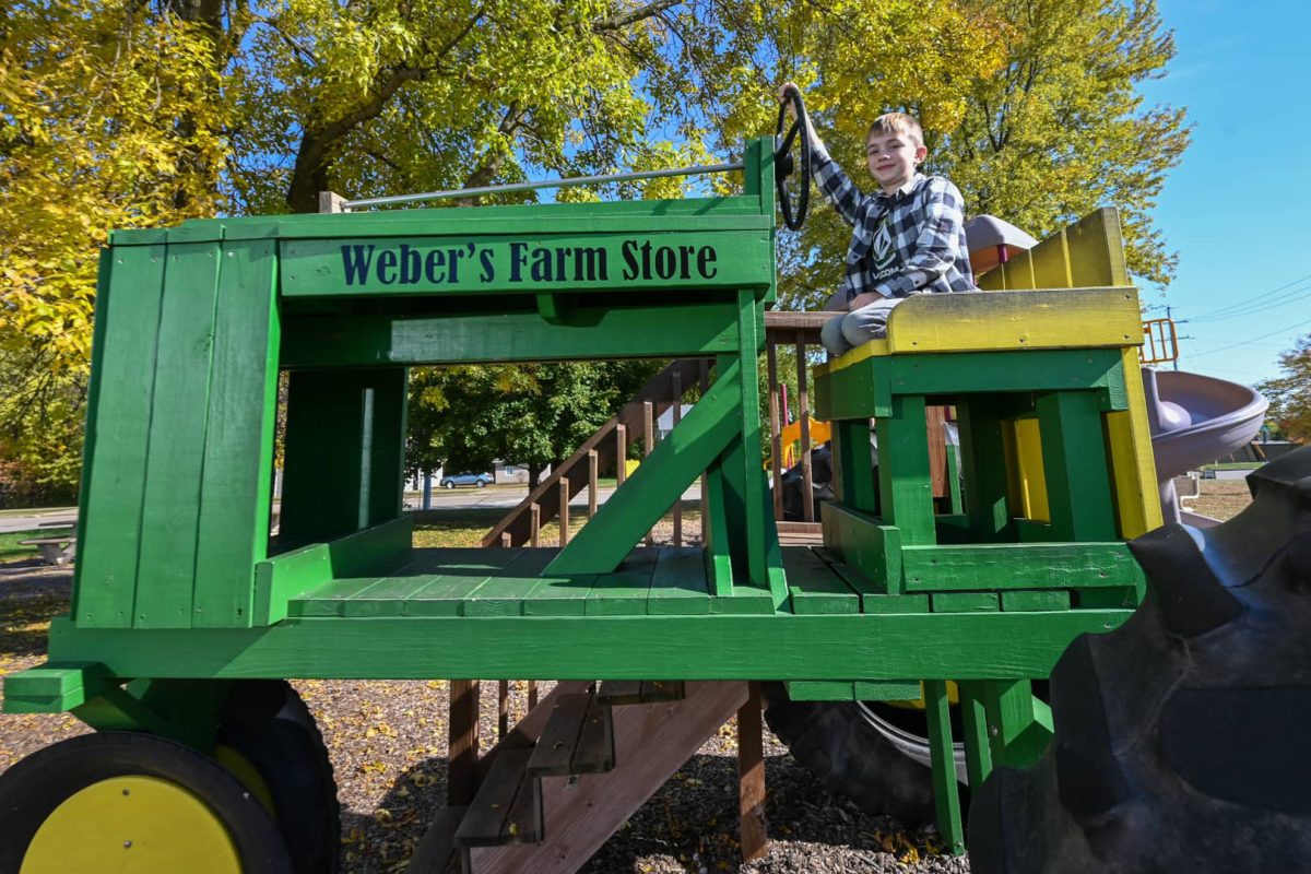 Boy on tractor at Weber’s Farm Store Marshfield WI