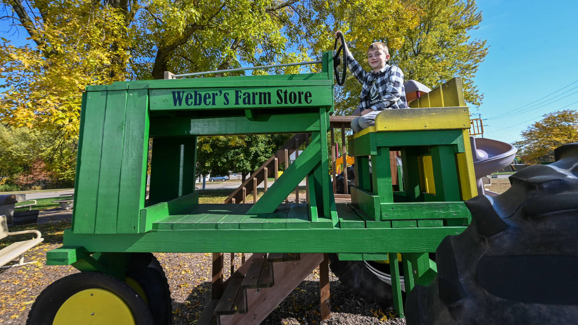 Fun fall attractions in and around Marshfield | Boy on tractor at Weber’s Farm Store Marshfield WI