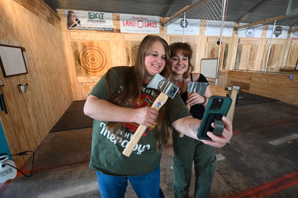 Women taking a selfie at Grey Dog Axe Throwing in downtown Marshfield Wisconsin