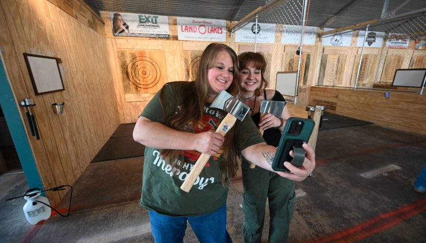 Women taking a selfie at Grey Dog Axe Throwing in downtown Marshfield Wisconsin