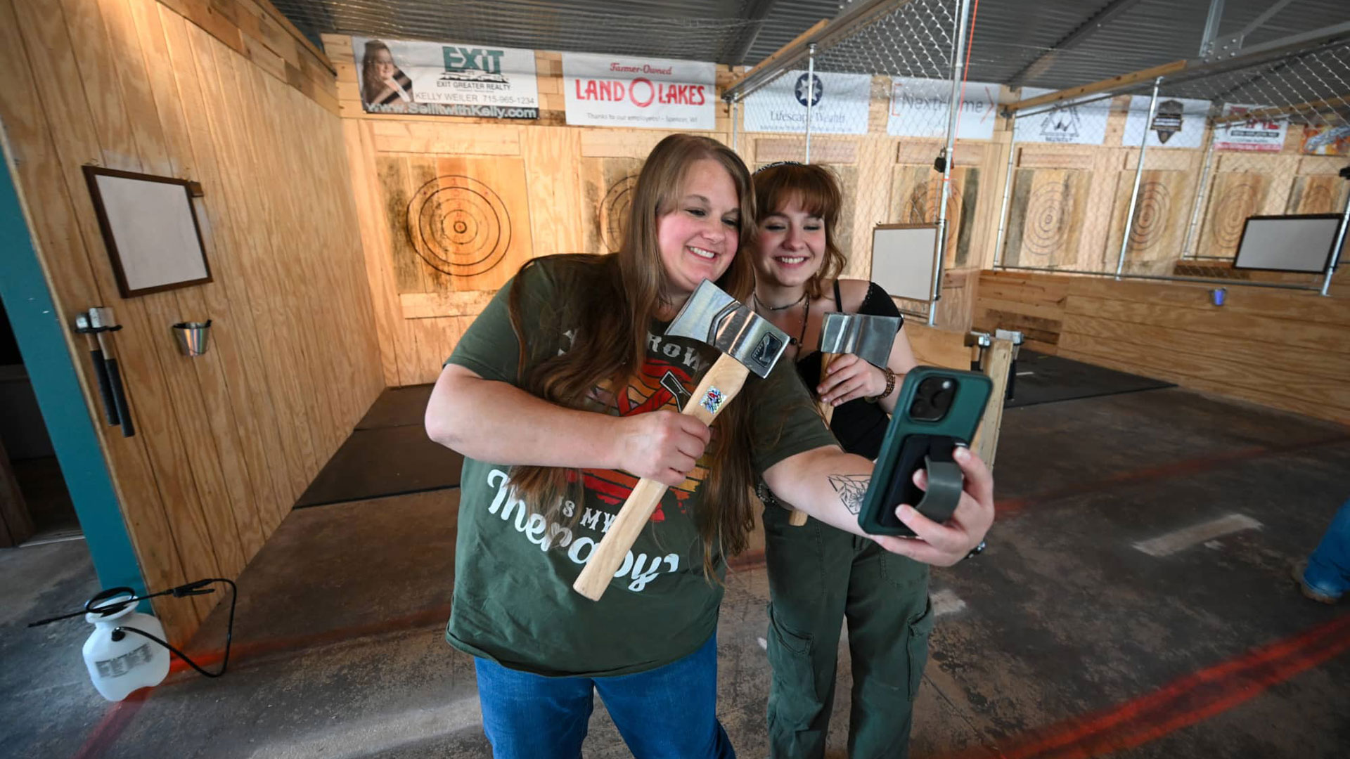 Meet Marshfield Made New: Downtown’s Attractions District | Women taking a selfie at Grey Dog Axe Throwing in downtown Marshfield Wisconsin