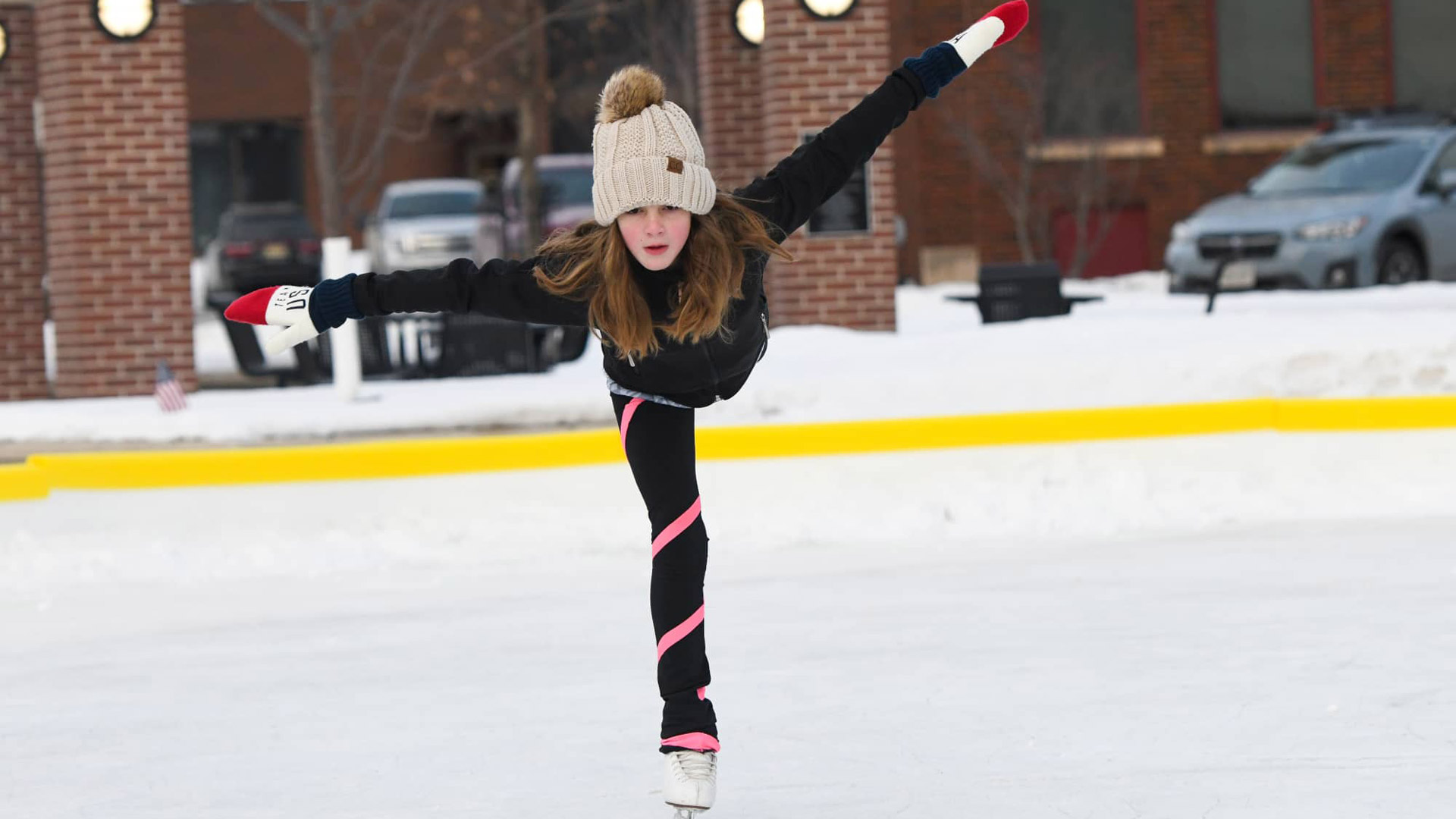 Your winter guide to Marshfield | Girl ice skating at Wenzel Family Plaza in downtown Marshfield WI