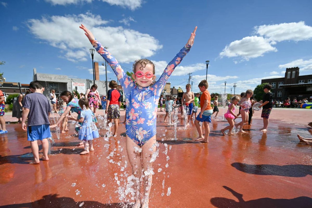 Meet Marshfield Made New: Wenzel Family Plaza | Children playing in splash pad at Wenzel Family Plaza downtown Marshfield Wisconsin