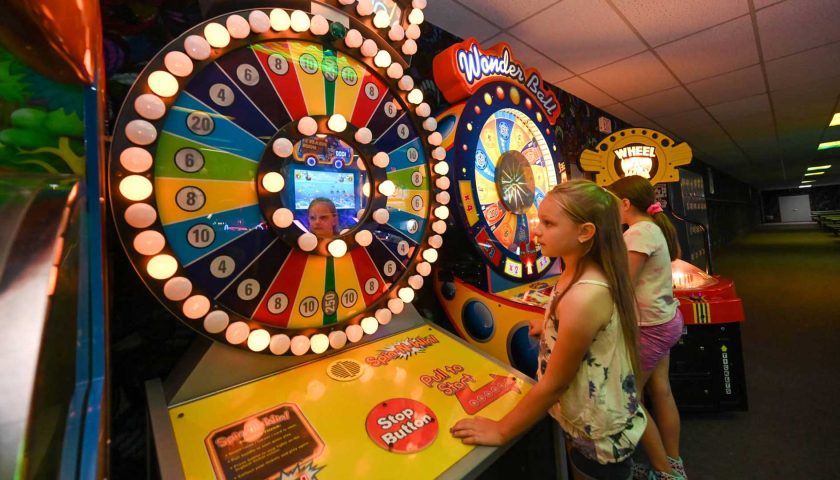 Two girls playing games in the arcade at Melody Gardens Restaurant & Skateland in Marshfield Wisconsin