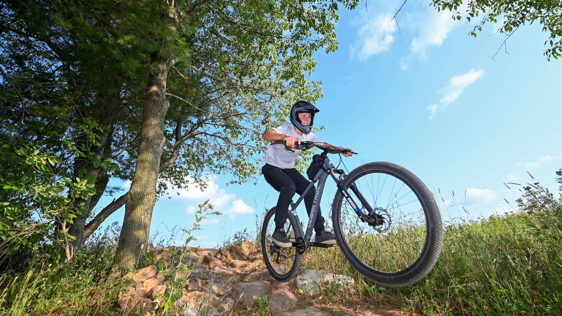Explore Powers Bluff and discover fun all year long | Boy riding mountain bike trails at Powers Bluff County Park near Marshfield Wisconsin