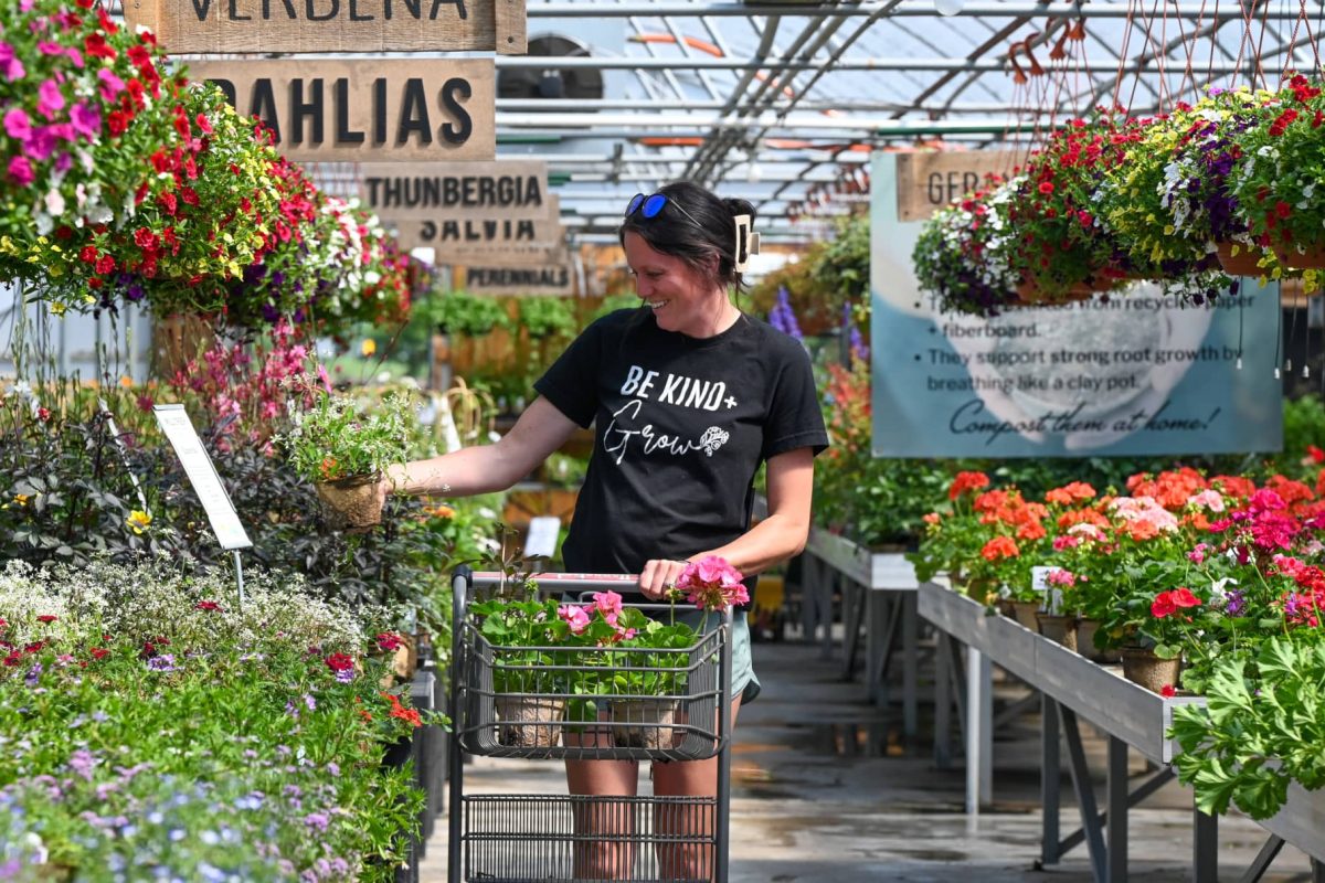 Woman shopping for flowers at the garden store at Mill Creek Gardens in Marshfield Wisconsin